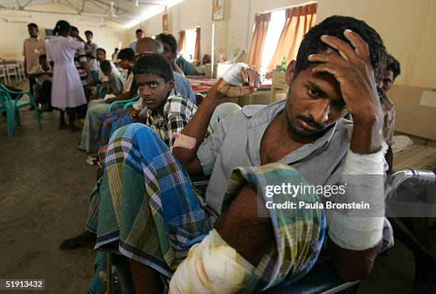 Tsunami earthquake victim waits for medical treatment provided by the Korean Disaster Medical Assistance team at the district hospital of Kilinochchi...