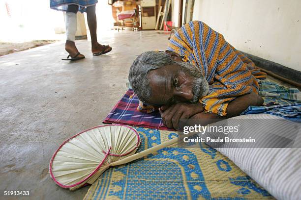 Tsunami earthquake victim waits for medical care provided by the Korean Disaster Medical Assistance team at the District hospital of Kilinochchi...
