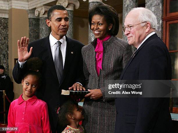 Senator Barack Obama poses for with his wife Michelle , Vice President Dick Cheney , daughters Malia and Sasha during the reenactment of a swearing...
