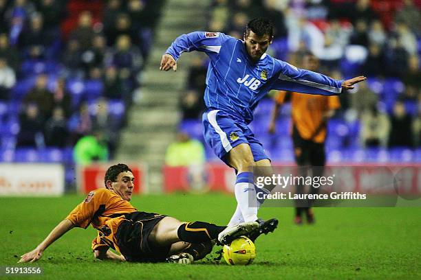 Lee McCulloch of Wigan battles with Keith Andrews of Wolves during the Coca-Cola Championship match between Wigan Athletic and Wolverhampton...