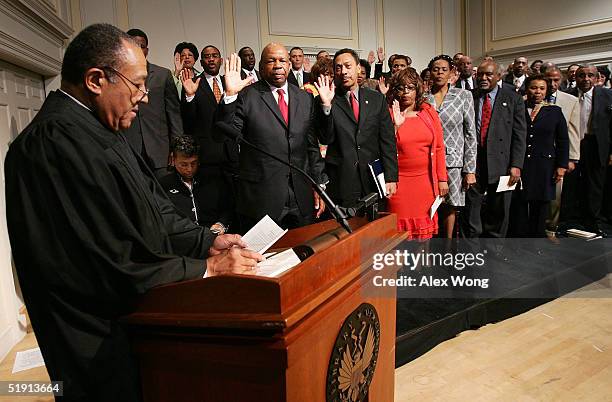 Retired North Carolina Supreme Court Chief Justice Henry Frye swears in members of the Congressional Black Caucus of the 109th Congress January 4,...