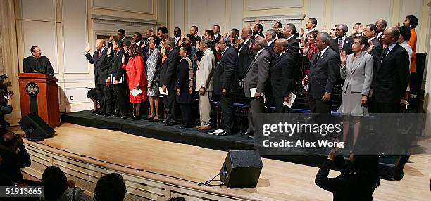 Retired North Carolina Supreme Court Chief Justice Henry Frye swears in members of the Congressional Black Caucus of the 109th Congress January 4,...