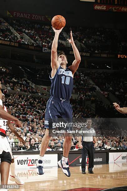 Gordan Giricek of the Utah Jazz shoots against the Portland Trail Blazers during the game on December 12, 2004 at the Rose Garden Arena in Portland,...