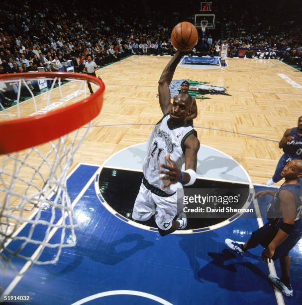 Kevin Garnett of the Minnesota Timberwolves drives to the basket for a dunk during a game against the Washington Wizards at Target Center on December...