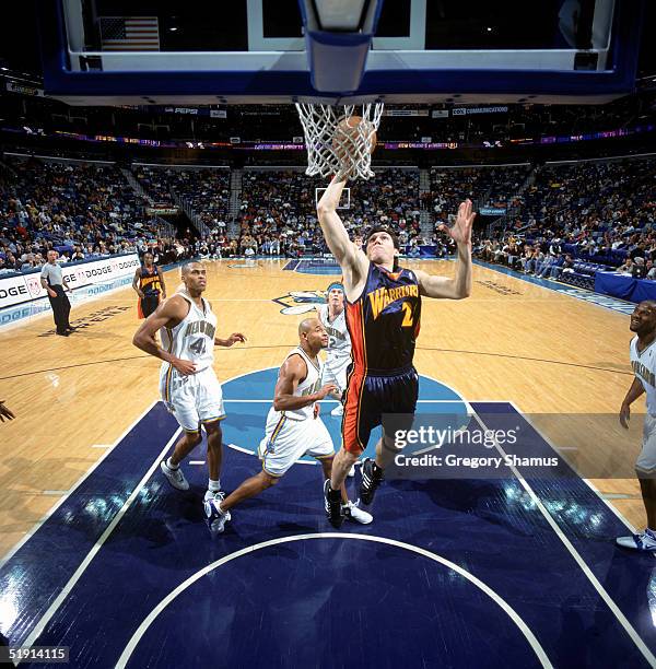 Eduardo Najera of the Golden State Warriors lays up a shot during the game against the New Orleans Hornets at New Orleans Arena on December 15, 2004...