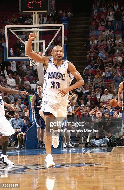 Grant Hill of the Orlando Magic runs on the court during the game with the Memphis Grizzlies at TD Waterhouse Centre on December 4, 2003 in Orlando,...