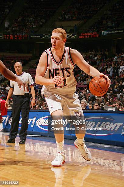 Brian Scalabrine of the New Jersey Nets moves the ball against the Atlanta Hawks during the game on December 4, 2004 at the Continental Airlines...