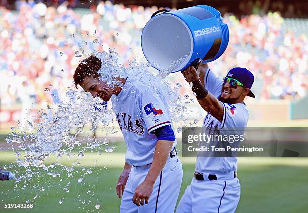 Rougned Odor of the Texas Rangers dunks starting pitcher Cole Hamels of the Texas Rangers with a water cooler after the Rangers beat the Seattle...