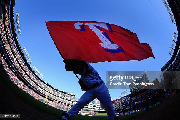 Captain, the Texas Rangers mascot, waves the team flag after the Texas Rangers beat the Seattle Mariners 3-2 on Opening Day at Globe Life Park in...