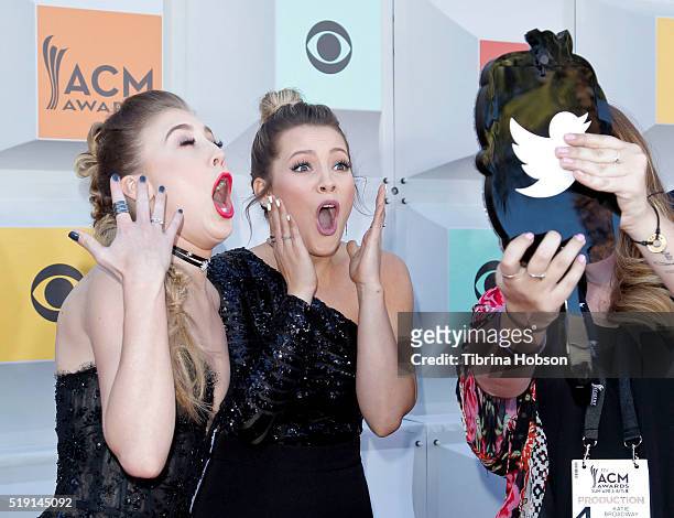 Maddie Marlow and Tae Dye of Maddie & Tae take a selfie at the 51st Academy of Country Music Awards at MGM Grand Garden Arena on April 3, 2016 in Las...