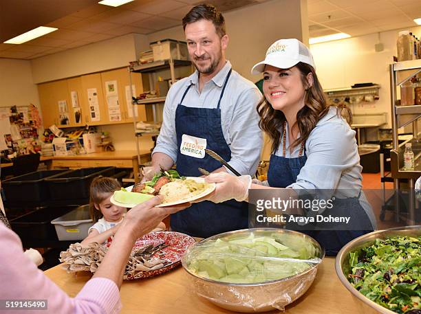 Harper Renn Smith, Brady Smith and Tiffani Thiessen volunteering at Downtown Women's Center in Los Angeles as a part of The Feeding America Pledge to...