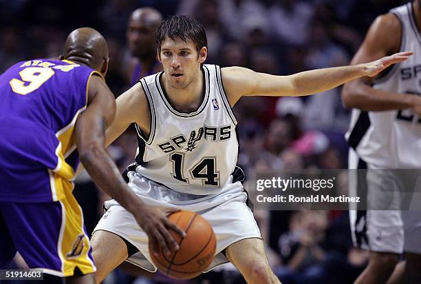 Guard Beno Udrih of the San Antonio Spurs plays defense against Chucky Atkins of the Los Angeles Lakers on January 4, 2005 at the SBC Center in San...