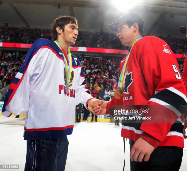 Sidney Crosby of Canada and Alexander Ovechkin of Russia shake hands after Canada won the gold medal game 6-1 over Russia at the World Junior Hockey...