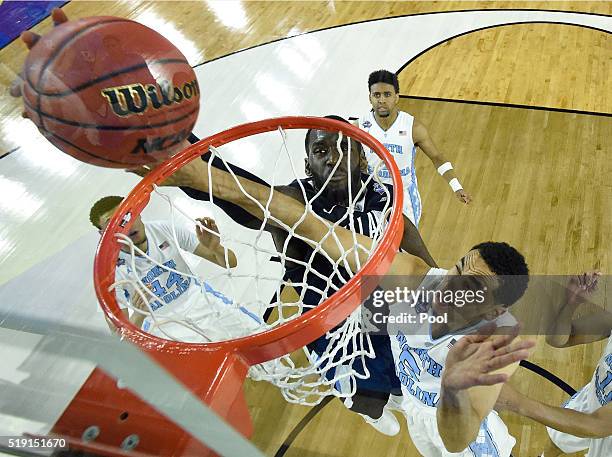 Daniel Ochefu of the Villanova Wildcats shoots the ball against Marcus Paige of the North Carolina Tar Heels in the first half of the 2016 NCAA Men's...