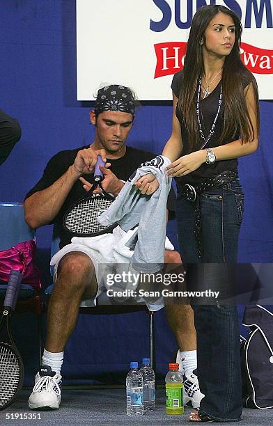 Mark Philippoussis of Australia and his girlfriend Alexis Barbara relax at a training session during the Hopman Cup at the Burswood Dome January 5,...
