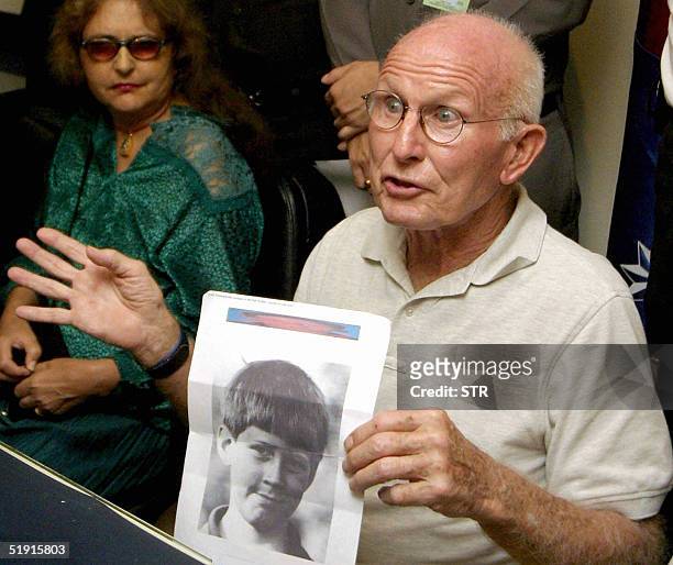 Citizen Daniel Walker shows a picture of his grandson Kristian Walker during a press conference at tourist police headquarters Phuket Island, 05...