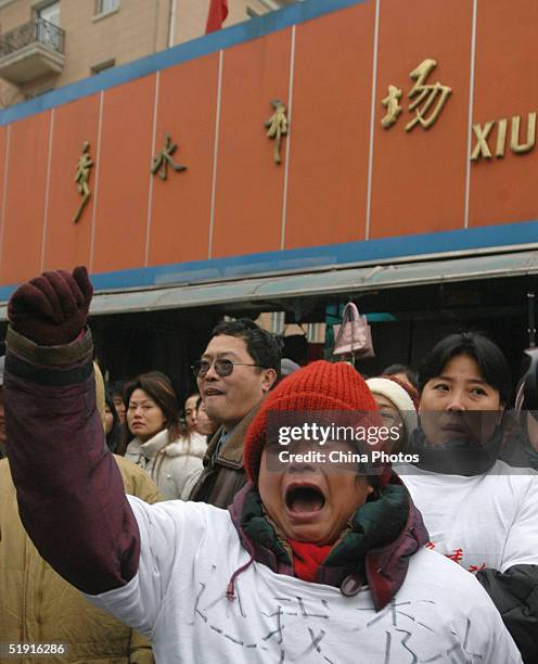 Stall holders from the Xiushui Market protest the closure of the market on January 5, 2005 in Beijing, China. The capital's 20-year-old outdoor...