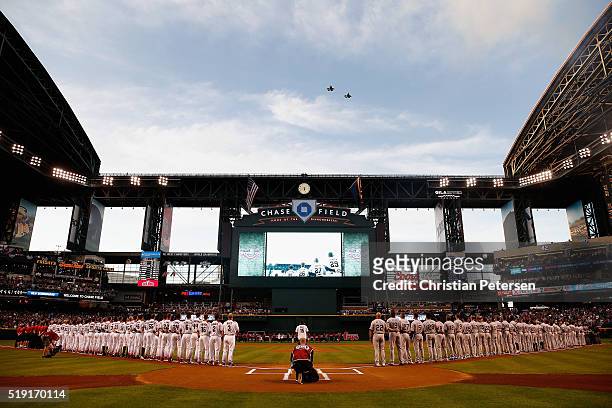 General view of the national anthem as the Arizona Diamondbacks and Colorado Rockies stand attended before the MLB opening day game at Chase Field on...