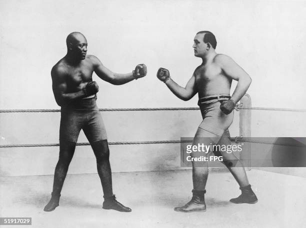 American boxers Jack Johnson and James J. Jeffries face off in the ring before the start of the World Heavyweight Championship, Reno, Nevada, July 7,...