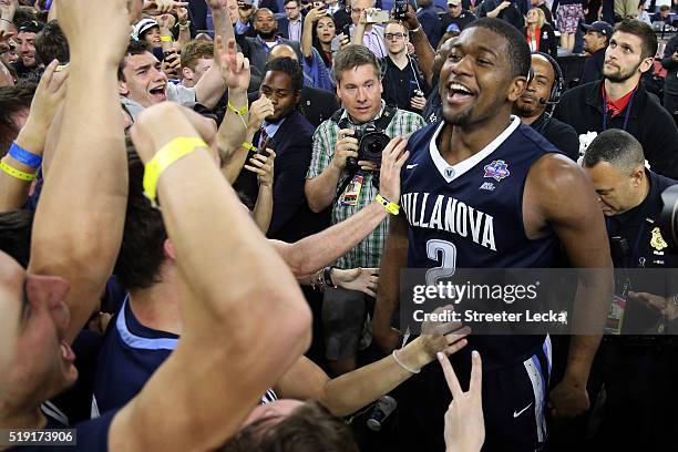 Kris Jenkins of the Villanova Wildcats celebrates after making the game-winning three pointer to defeat the North Carolina Tar Heels 77-74 in the...