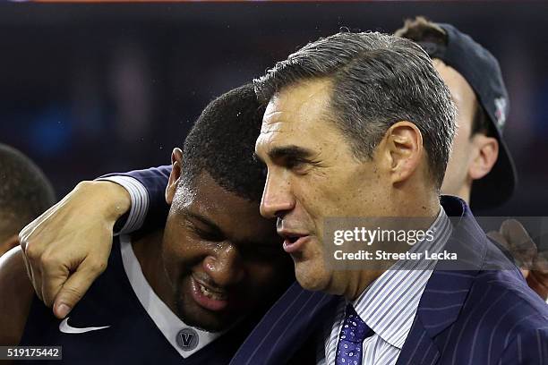 Kris Jenkins of the Villanova Wildcats celebrates with head coach Jay Wright after defeating the North Carolina Tar Heels 77-74 to win the 2016 NCAA...