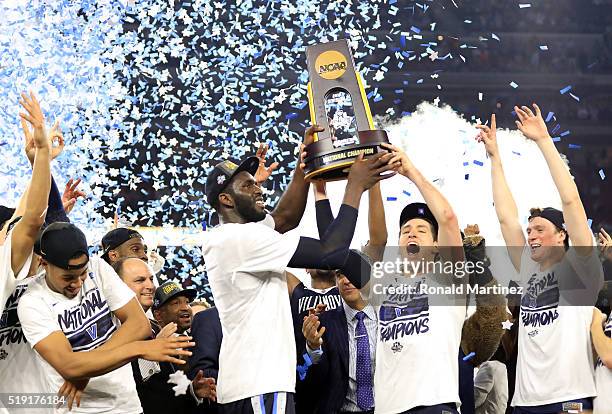 Daniel Ochefu of the Villanova Wildcats and Ryan Arcidiacono hoist the trophy after the Villanova Wildcats defeat the North Carolina Tar Heels 77-74...