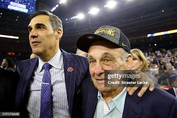 Head coach Jay Wright of the Villanova Wildcats celebrates with former Villanova Wildcats head coach Rollie Massimino after defeating the North...