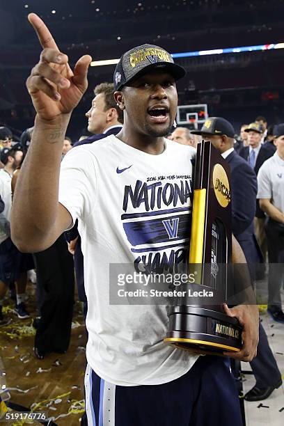 Kris Jenkins of the Villanova Wildcats celebrates with the trophy after defeating the North Carolina Tar Heels 77-74 to win the 2016 NCAA Men's Final...