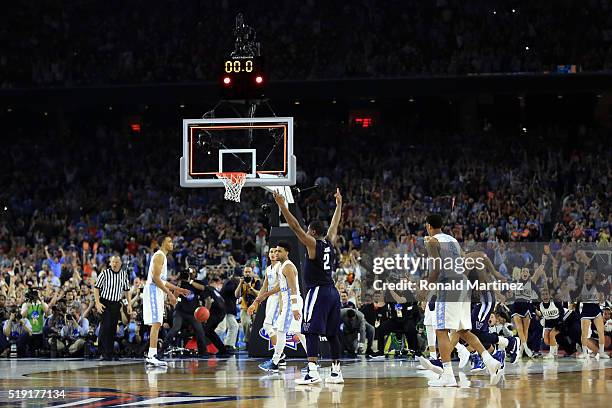 Kris Jenkins of the Villanova Wildcats celebrates after making the game-winning three pointer to defeat the North Carolina Tar Heels 77-74 in the...