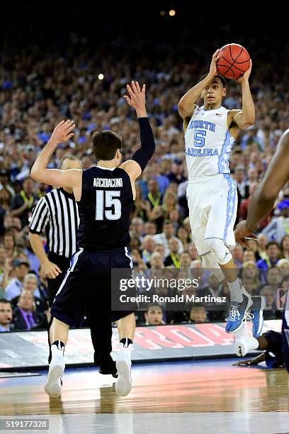 Marcus Paige of the North Carolina Tar Heels shoots a three-pointer to tie the game with 4.7 seconds left in the second half against the Villanova...