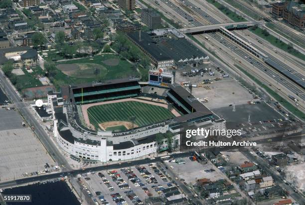 Aerial view of Comiskey Park and surrounding parking lots, highways, and buildings, Chicago, Illinois, May 1984.