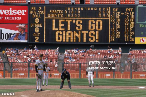 The scoreboard at Candlestick Park says, 'Let's Go Giants!' during the fifth inning of a baseball game between the San Francisco Giants and the...