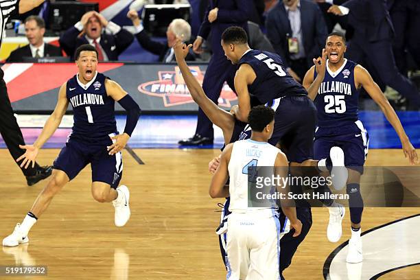 Kris Jenkins of the Villanova Wildcats celebrates with teammates after making the game-winning three pointer to defeat the North Carolina Tar Heels...