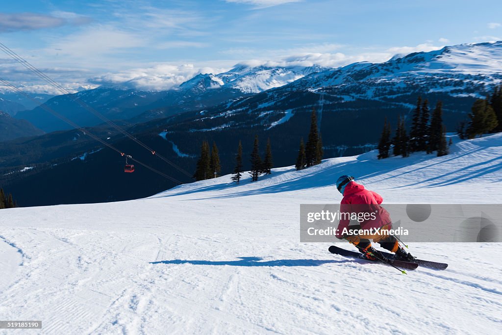 Female athlete skiing in the mountains