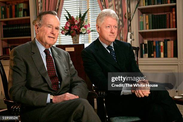 Former U.S. Presidents George H. W. Bush and Bill Clinton film a public service announcement in the White House Library encouraging Americans to make...