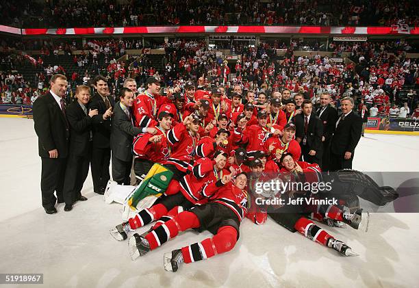 Members of Team Canada pose for a photo with the World Junior Championship trophy after Canada won the gold medal game 6-1 over Russia at the World...