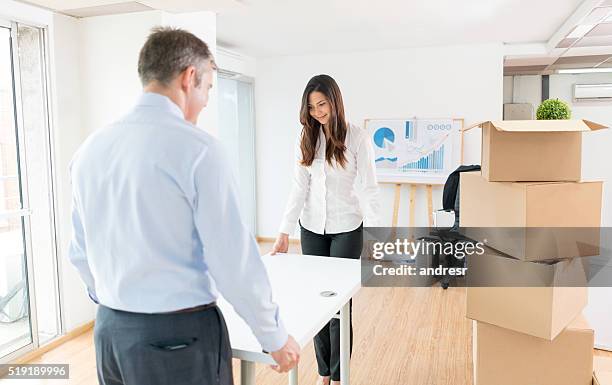 business people moving to a new office - picking up mail stock pictures, royalty-free photos & images