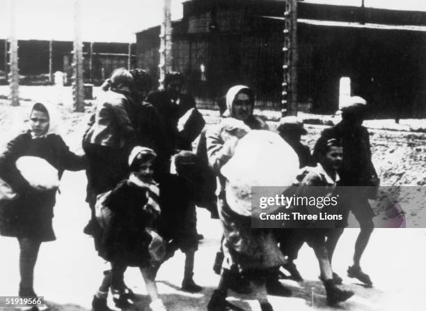 Group of women and children arriving at the Nazi concentration camp at Auschwitz, Poland, circa 1943.