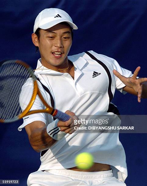 Taiwanese tennis player Lu Yen-Hsun plays a shot during his second round match against Belgian player Kristof Vliegen in the Chennai Open Tennis...