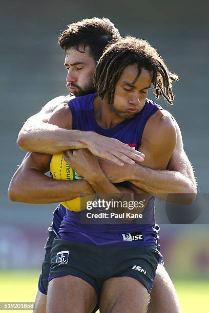 Tendai Mzungu of the Dockers gets tackled by Tanner Smith of the Dockers during Fremantle Dockers AFL training session at Fremantle Oval on April 5,...