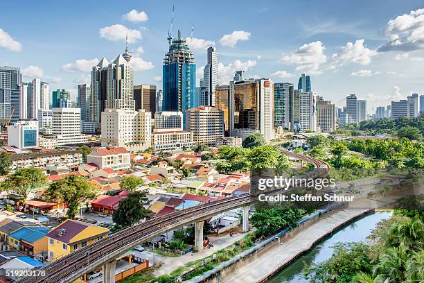 skyline kuala lumpur nice day railroad track local traffic transport - lille stockfoto's en -beelden