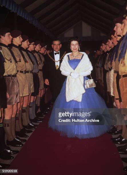 Queen Elizabeth II inspects boy scouts at a performance of the scouting revue, 'The Gang Show', 1967.