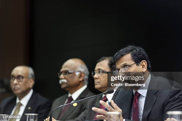 Raghuram Rajan, governor of the Reserve Bank of India , right, speaks during a news conference in Mumbai, India, on Tuesday, April 5, 2016. India's...