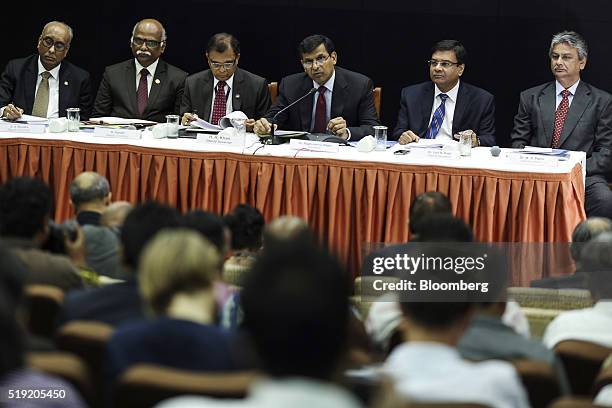 Raghuram Rajan, governor of the Reserve Bank of India , center, speaks during a news conference in Mumbai, India, on Tuesday, April 5, 2016. India's...