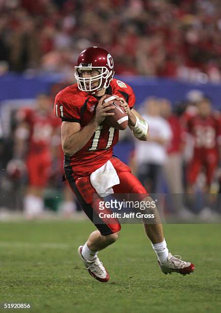 Quarterback Alex Smith of Utah looks to pass against Pittsburgh in the second quarter of the Tostito's Fiesta Bowl at the Sun Devil Stadium on...