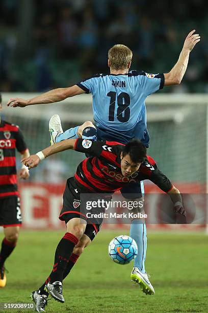 Matt Simon of Sydney FC and Kim Junsu p of the Pohang Steelers compete for the ball during the AFC Champions League match between Sydney FC and...