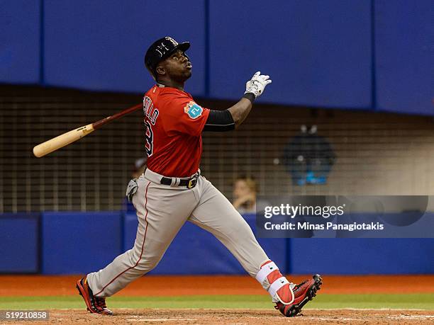 Rusney Castillo of the Boston Red Sox looks towards his ball during the MLB spring training game against the Toronto Blue Jays at Olympic Stadium on...