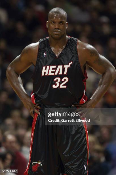 Shaquille O'Neal of the Miami Heat stands on the court during the game against the Toronto Raptors at Air Canada Centre on December 12, 2004 in...