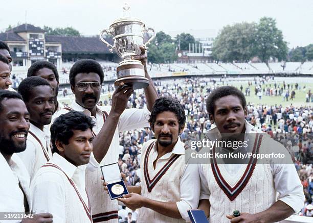 West Indies captain Clive Lloyd holding the trophy, surrounded by his team-mates after their victory over England in the Prudential World Cup Final...