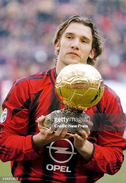Andrei Shevchenko of AC Milan holds the trophy after winning the European Golden Ball award 2004 before the Serie A Match between Milan and Lecce at...